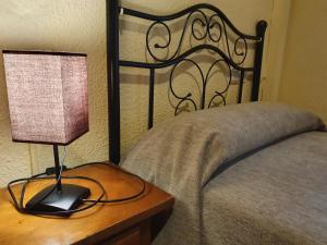 Postel nebo postele na pokoji v ubytování Arteaga Hostal & Baños Arabes Elvira