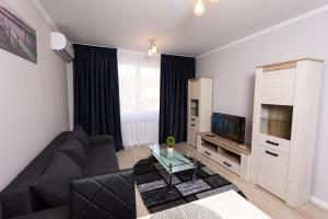 TV a/nebo společenská místnost v ubytování Povi Residence
