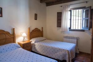 A bed or beds in a room at RuralEcofilabres