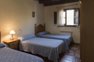 A bed or beds in a room at RuralEcofilabres