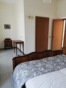 A bed or beds in a room at Residenza Santa Valeria