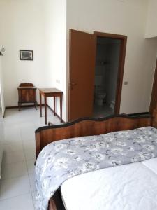 A bed or beds in a room at Residenza Santa Valeria