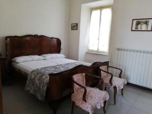A bed or beds in a room at Residenza Santa Valeria
