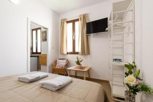 Postel nebo postele na pokoji v ubytování Apartamento Realejo Casco Historico