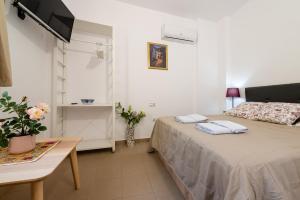 Postel nebo postele na pokoji v ubytování Apartamento Realejo Casco Historico