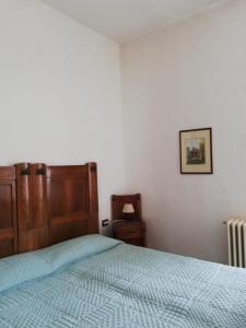 A bed or beds in a room at Residenza Santa Valeria