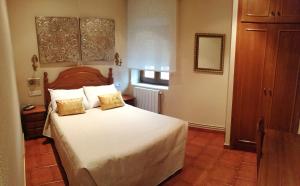 Postel nebo postele na pokoji v ubytování Hostal Mizmaya