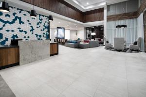 an office lobby with a reception desk and chairs at Hyatt Place Bakersfield in Bakersfield