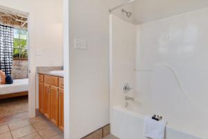 a bathroom with a shower and a sink at Luxury Arts District Apartments in New Orleans +21 photos