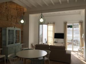 a living room with a couch and a table at Cream homes Santa Catalina ETV in Palma de Mallorca