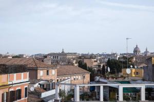 a view of a city with buildings at Pink Intimate Jacuzzi Suite Trastevere - Top Collection in Rome