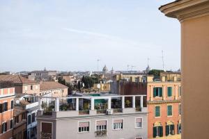 a view of a city from a building at Pink Intimate Jacuzzi Suite Trastevere - Top Collection in Rome