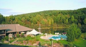 an aerial view of a house with a swimming pool at Commodores Inn in Stowe