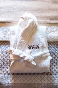 a towel sitting on top of a bed at Cascade Creek Retreat in Milton