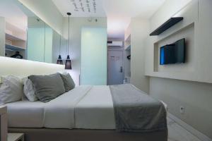Una televisión o centro de entretenimiento en Nobile Hotel Copacabana Design