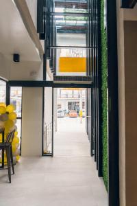 an internal corridor of a building with plants at Yello Hotel Cebu powered by Cocotel in Cebu City
