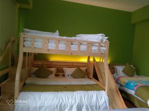 Postel nebo postele na pokoji v ubytování 知本赫克力士親子民宿Chihpen Hercules Family Homestay