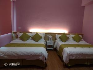 Postel nebo postele na pokoji v ubytování 知本赫克力士親子民宿Chihpen Hercules Family Homestay