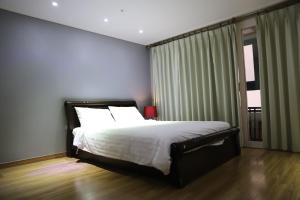 Rúm í herbergi á Residence Hotel Lamia