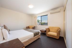 Postel nebo postele na pokoji v ubytování Coral Cay Resort