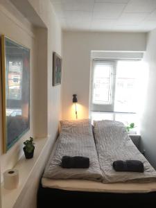 Säng eller sängar i ett rum på Sleep & Go Copenhagen