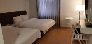 Postel nebo postele na pokoji v ubytování Hillside Hotel