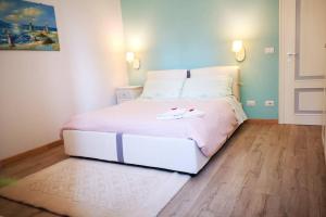 Tempat tidur dalam kamar di Delizioso appartamento cosy ristrutturato
