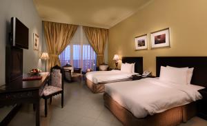 Un pat sau paturi într-o cameră la Masira Island Resort