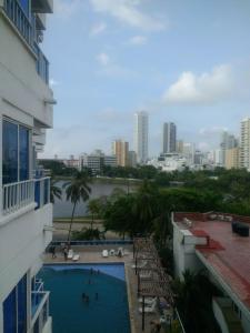 einen Blick vom Balkon eines Gebäudes mit Pool in der Unterkunft Apartment in Cartagena Ocean Front 1C5 in Cartagena de Indias