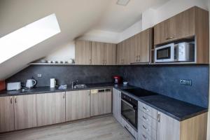 Kuchyňa alebo kuchynka v ubytovaní Apartmány pod Jeřábem, Šanov 67, Červená Voda