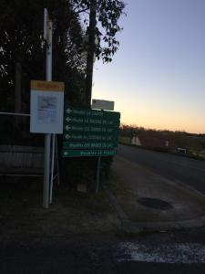 a sign on the side of a road at Le Piquet Résidence-Pavillon in Cazaubon