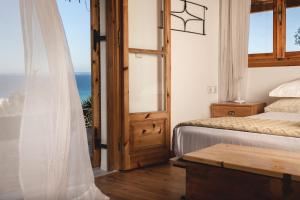 Ένα ή περισσότερα κρεβάτια σε δωμάτιο στο Villa Rocale +36 φωτογραφίες