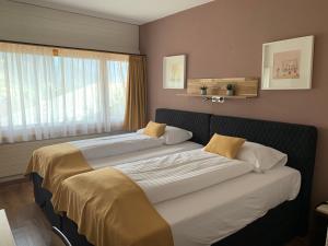 Postel nebo postele na pokoji v ubytování Chalet-Hotel Beau-Site