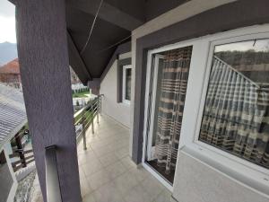 a balcony of a house with a view at Guest house Vlahovic in Kolašin