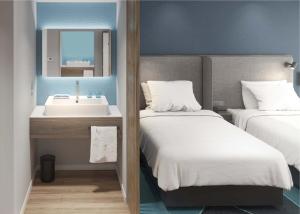 Holiday Inn Express Urumqi Station by IHG客房内的一张或多张床位
