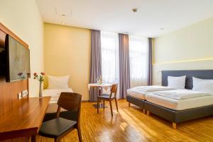 Postel nebo postele na pokoji v ubytování Hotel Apfelbaum
