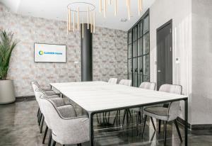 a conference room with a white table and chairs at Ilunion Alcalá Norte in Madrid