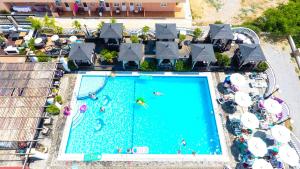 an overhead view of a swimming pool at a resort at Coralli Apartments in Pefki +16 photos