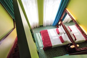 En eller flere senge i et værelse på Domina St.Petersburg