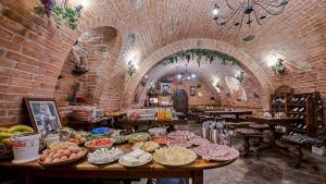 a room with a bunch of food on a table at Wellness Penzion Eva in Dolní Moravice