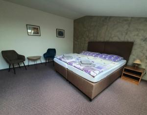 Кровать или кровати в номере Penzion Bily Beranek