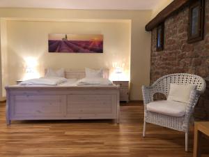 Postel nebo postele na pokoji v ubytování Hotel Weingärtner