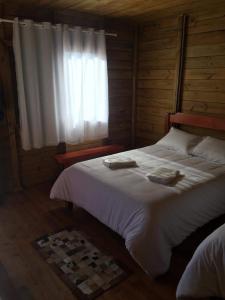 A bed or beds in a room at Pousada Bela Tereza