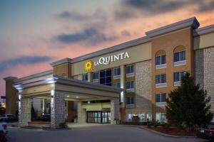 a hotel with a walmart sign on the front of it at La Quinta by Wyndham Effingham in Effingham