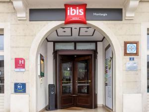 a building with a ups entrance with a sign above the door at ibis Montargis in Montargis