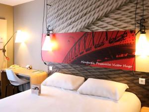 Letto o letti in una camera di ibis Montargis