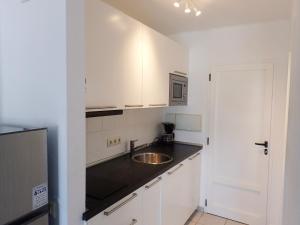 Kuchyň nebo kuchyňský kout v ubytování Apartamento en Playa Roca primer linea de mar (05)