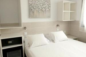 Posteľ alebo postele v izbe v ubytovaní Hostal House