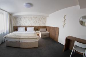 Voodi või voodid majutusasutuse Hotel Prichovice toas
