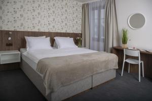 Voodi või voodid majutusasutuse Hotel Prichovice toas